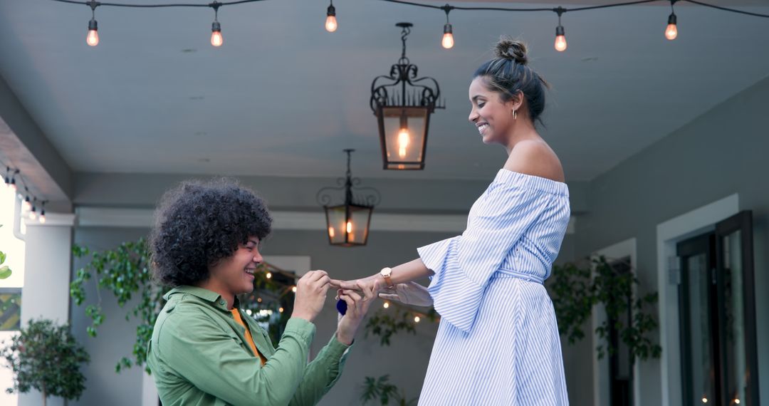 Man Proposing with Engagement Ring Amid Romantic Ambience