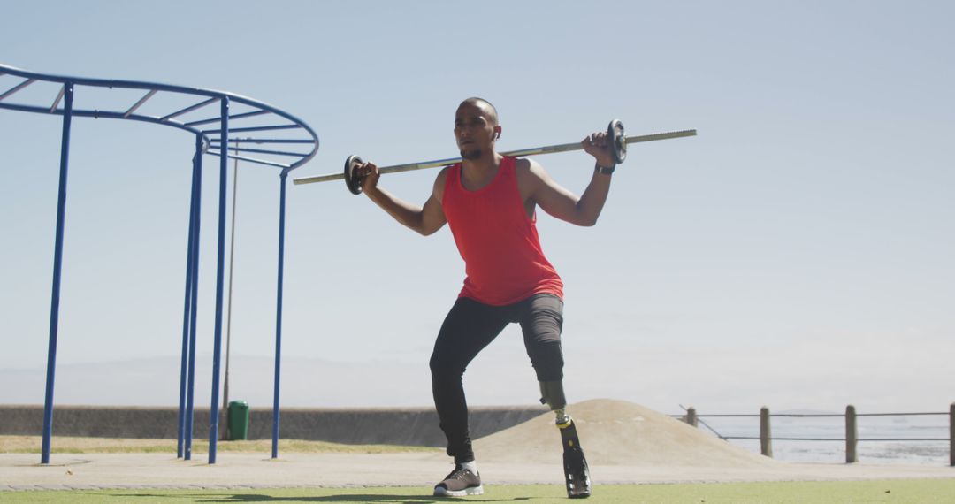 Man with Prosthetic Leg Exercising with Barbell Outdoors - Free Images, Stock Photos and Pictures on Pikwizard.com