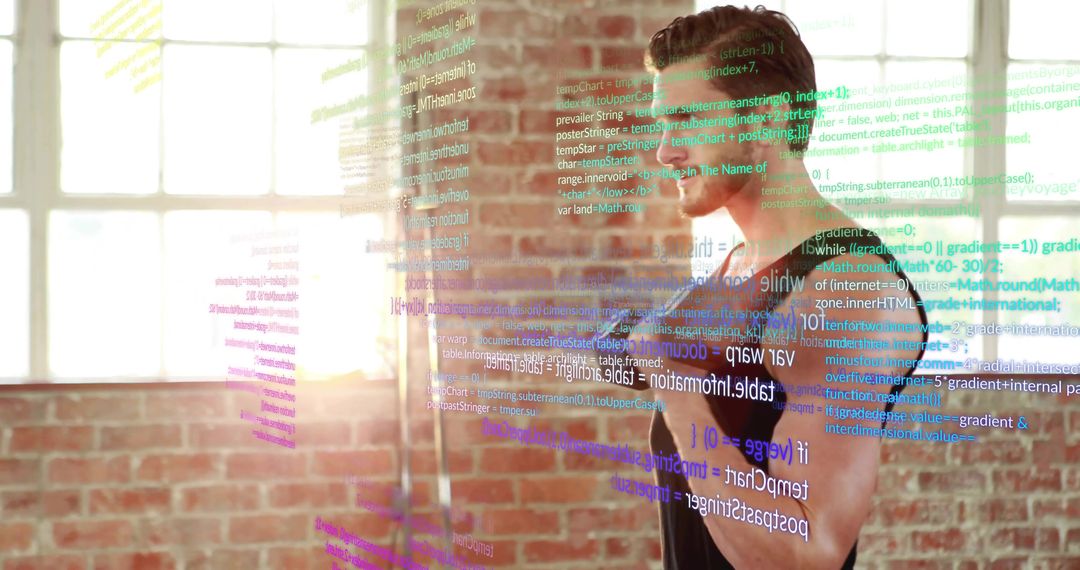 Male developer interacting with holographic code in sunlit industrial loft workspace