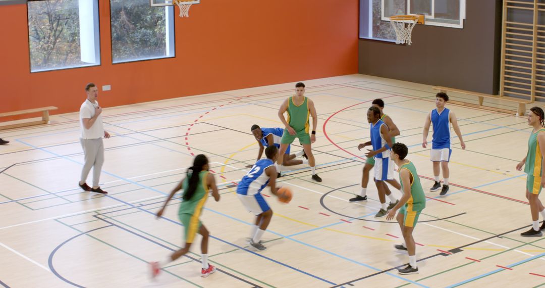 Intense Action During Basketball Practice on Indoor Court