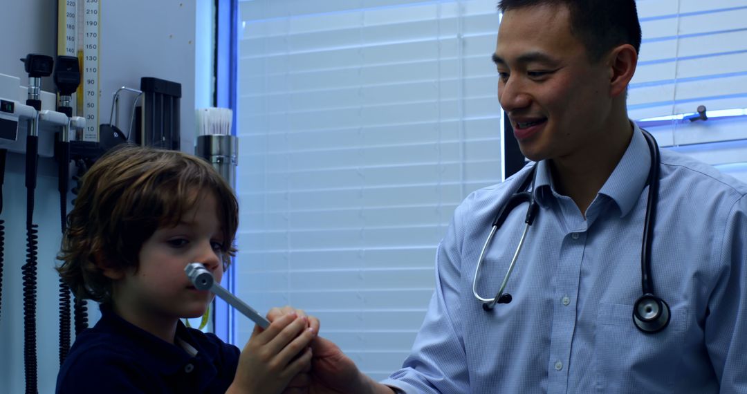 Pediatric Doctor Conducting Check-Up on Child in Medical Office - Free Images, Stock Photos and Pictures on Pikwizard.com