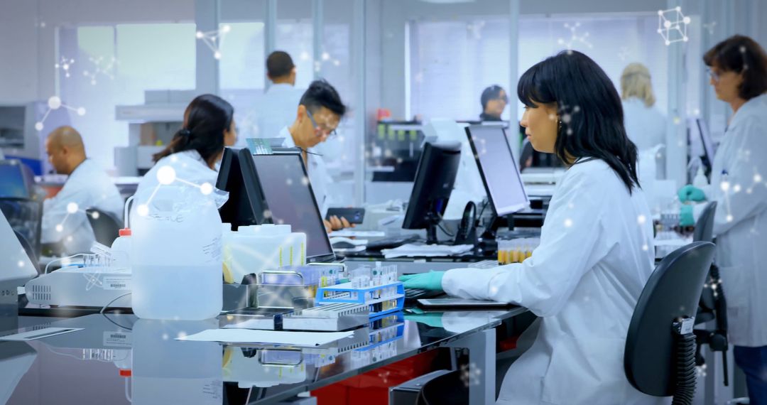 Diverse Scientists Executing Data Processing in Modern Laboratory