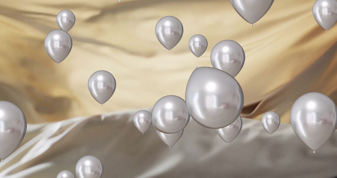 Floating Silver Balloons on Gold Backdrop for Celebrations