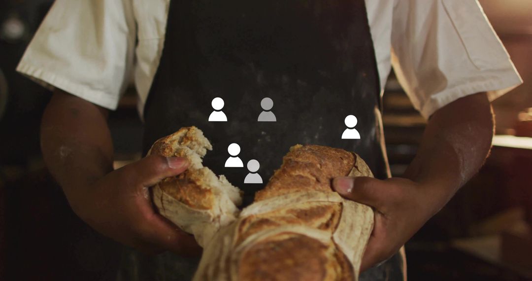 Baker Tearing Artisan Bread with Skillful Hands