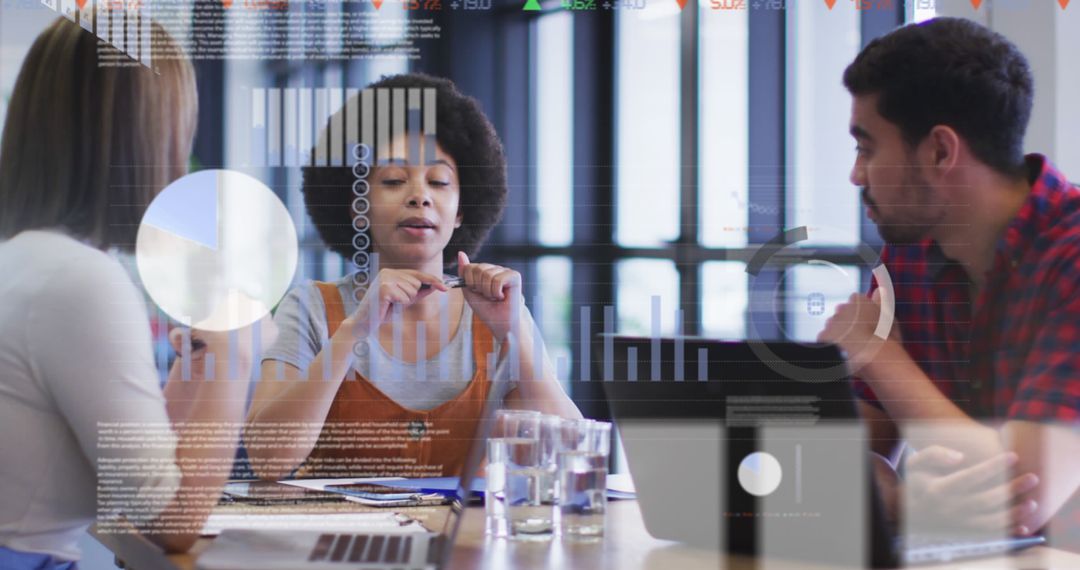 Team Analyzing Data Analytics in Modern Office Meeting