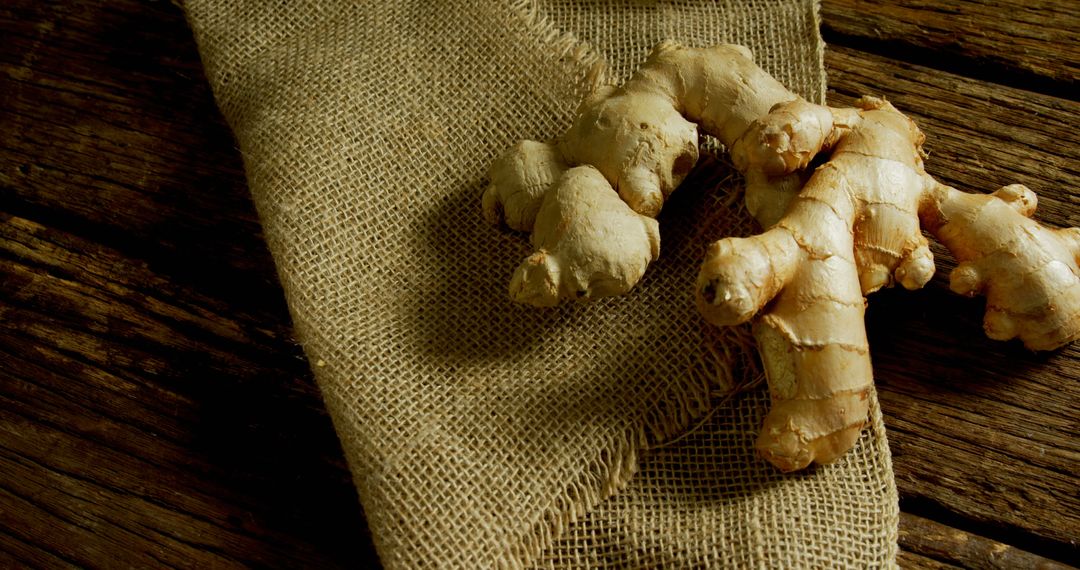 Fresh Ginger Root on Rustic Burlap and Wooden Surface - Free Images, Stock Photos and Pictures on Pikwizard.com