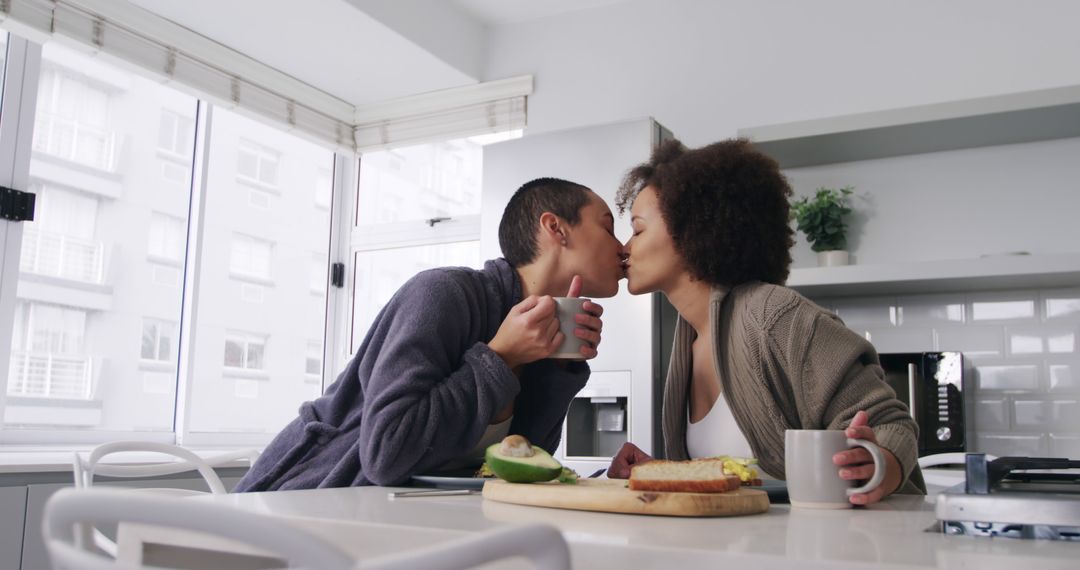 Loving Couple Sharing Breakfast in Modern Kitchen - Free Images, Stock Photos and Pictures on Pikwizard.com