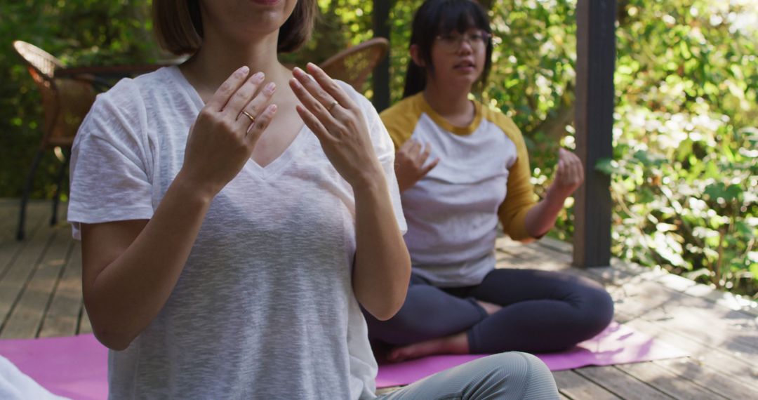 Women Practicing Outdoor Yoga Meditation on Wooden Deck in Forest - Free Images, Stock Photos and Pictures on Pikwizard.com