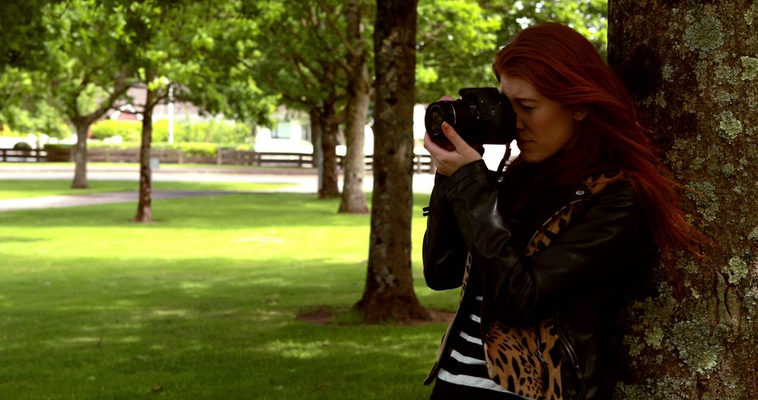 Young Woman Taking Photos in Park - Free Images, Stock Photos and Pictures on Pikwizard.com