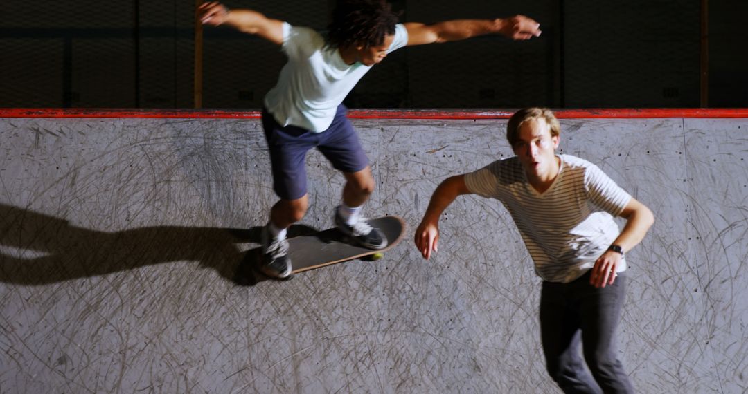 Young Skateboarders Performing Tricks at Skatepark - Free Images, Stock Photos and Pictures on Pikwizard.com