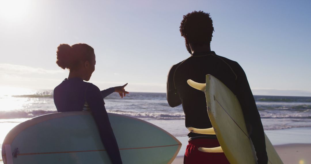 Couple with Surfboards Enjoying Beach Adventure - Free Images, Stock Photos and Pictures on Pikwizard.com