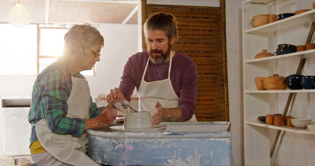 Senior Woman Learning Pottery with Instructor at Art Studio - Free Images, Stock Photos and Pictures on Pikwizard.com