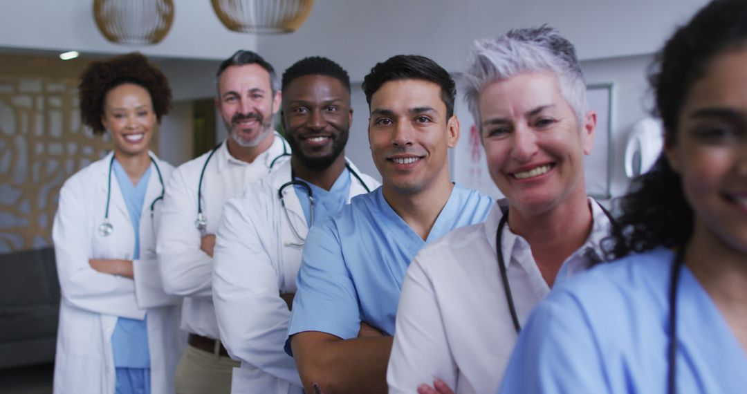 Smiling Diverse Healthcare Team Standing in Hospital Corridor - Free Images, Stock Photos and Pictures on Pikwizard.com