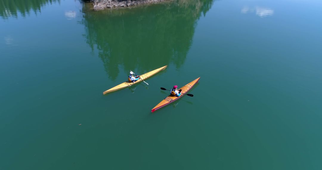 Aerial View of Two People Kayaking on Calm Lake - Free Images, Stock Photos and Pictures on Pikwizard.com