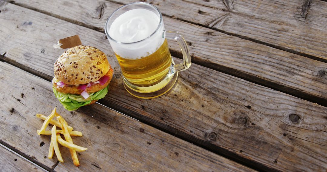 Beer and Burger Meal on Rustic Wooden Table - Free Images, Stock Photos and Pictures on Pikwizard.com