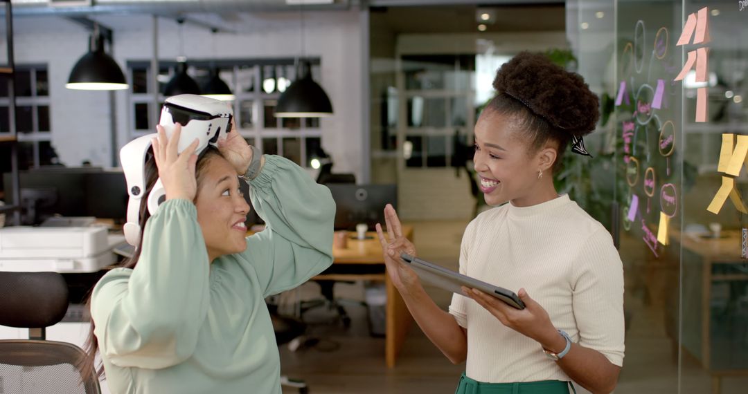 Colleagues Engaging with Virtual Reality Technology in Office