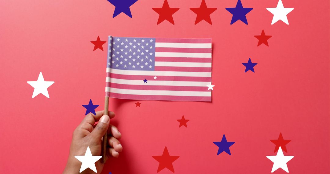 Hand Holding US Flag with Falling Stars on Red Background