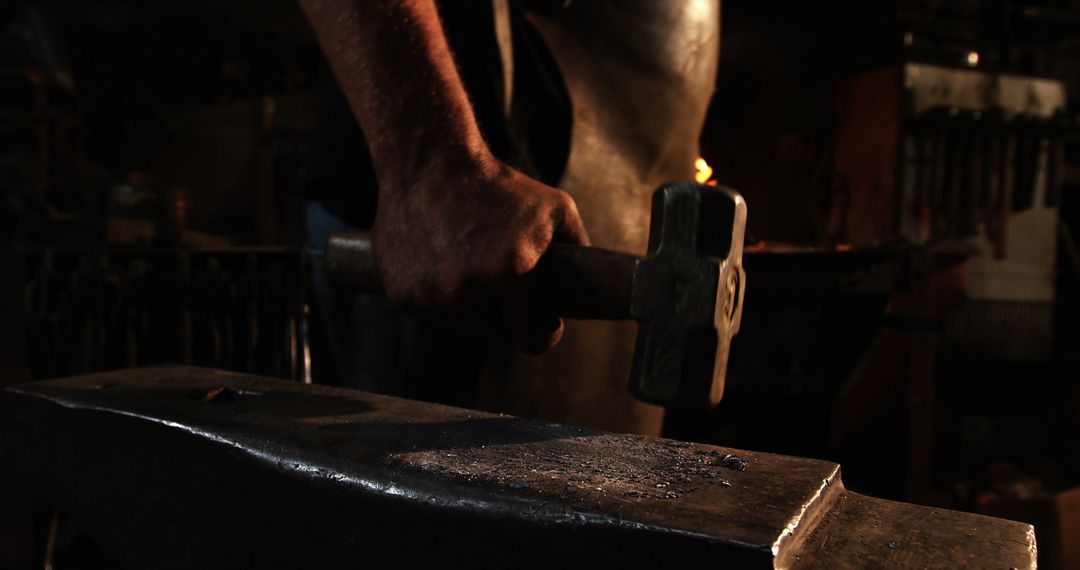 Blacksmith Holding Hammer with Anvil