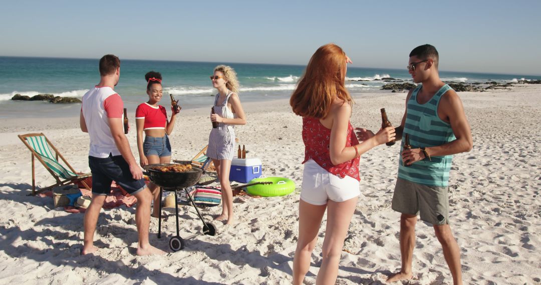 Group of Friends Enjoying a Beach BBQ on a Sunny Day - Free Images, Stock Photos and Pictures on Pikwizard.com