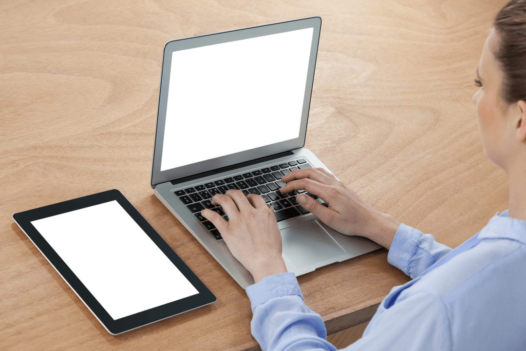Transparent Overlay: Businesswoman Working on Laptop by Tablet