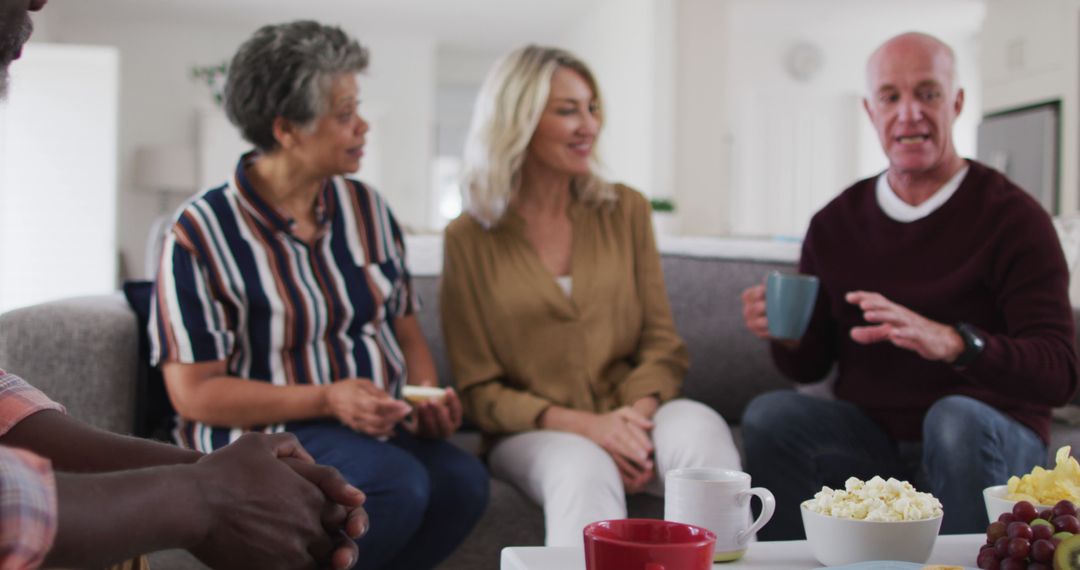 Group of Seniors and Middle-aged Friends Having a Casual Chat at Home - Free Images, Stock Photos and Pictures on Pikwizard.com