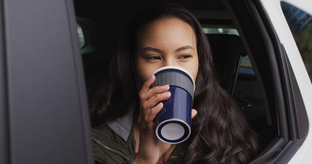 Young Woman Drinking Coffee in Car - Free Images, Stock Photos and Pictures on Pikwizard.com