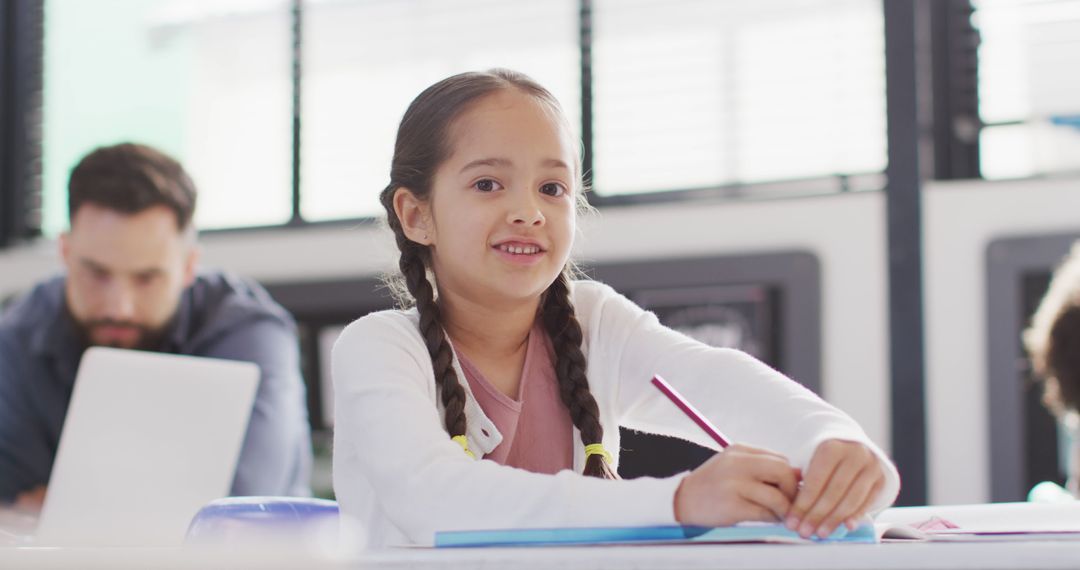 Smiling Biracial Schoolgirl Gaining Confidence in Classroom