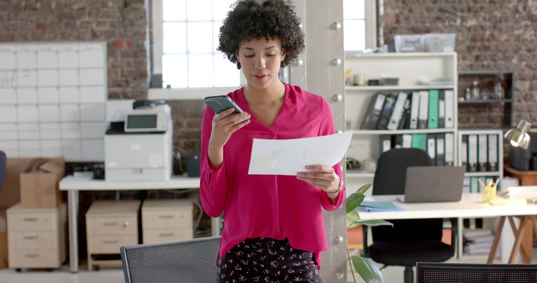 Professional Woman Reviewing Documents and Talking on Phone in Office - Free Images, Stock Photos and Pictures on Pikwizard.com