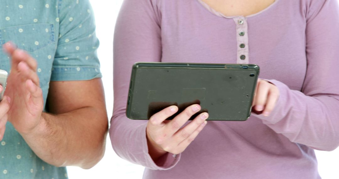 Close-up of Two People Using Digital Devices Together - Free Images, Stock Photos and Pictures on Pikwizard.com