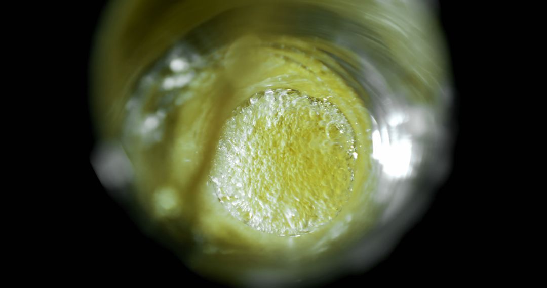 Close-Up View of Bubbles Forming in a Glass of Beer