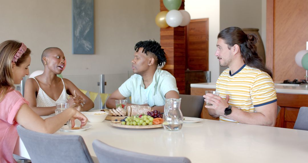 Friends Socializing Over Snacks At Home Gathering