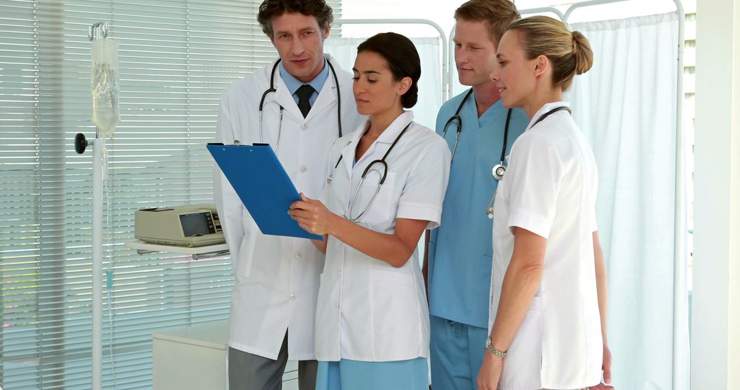 Team of Medical Professionals in Discussion at Hospital - Free Images, Stock Photos and Pictures on Pikwizard.com