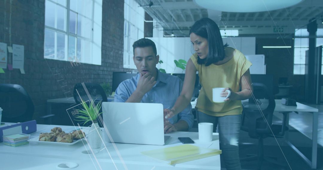 Business Team Collaborating in Modern Workspace with Coffee and Pastries