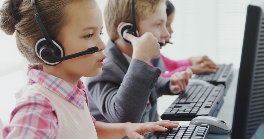 Young Children Working with Headsets in Office - Free Images, Stock Photos and Pictures on Pikwizard.com