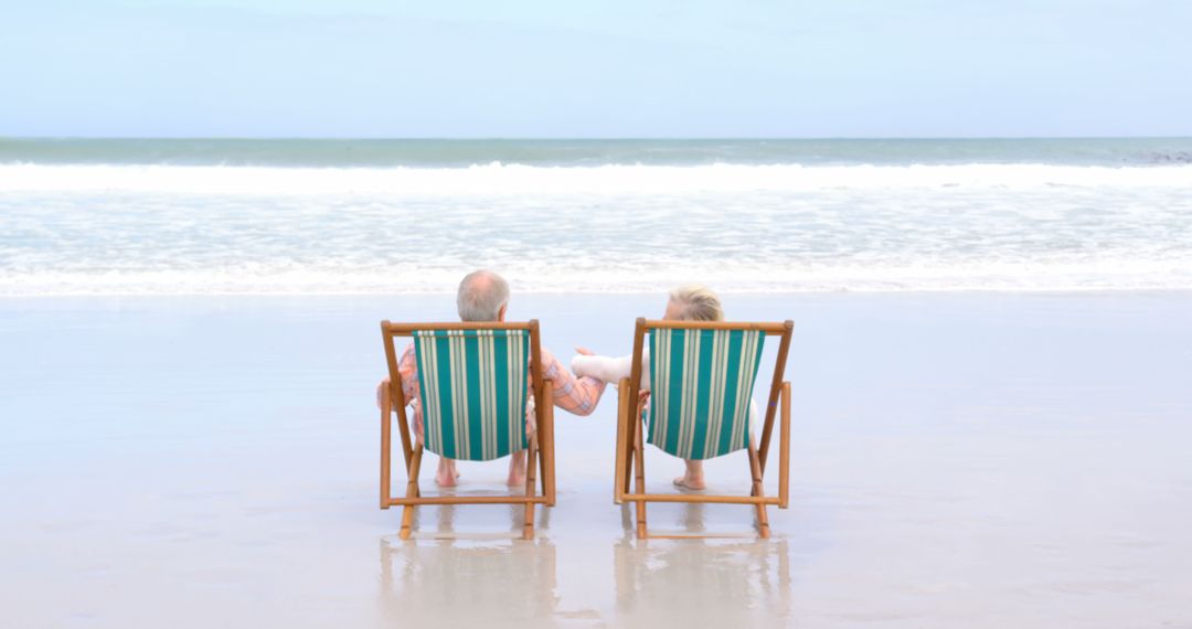 Elderly Couple Relaxing on Beach Chairs by Ocean - Free Images, Stock Photos and Pictures on Pikwizard.com