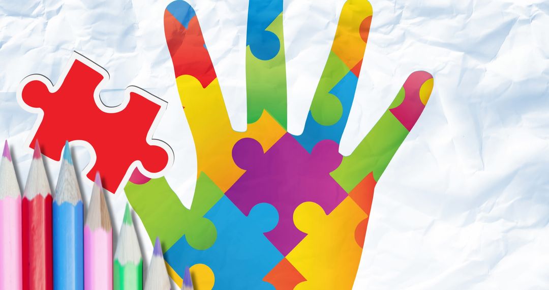Colorful Puzzle Hand with Pencils Representing Autism Awareness and Support