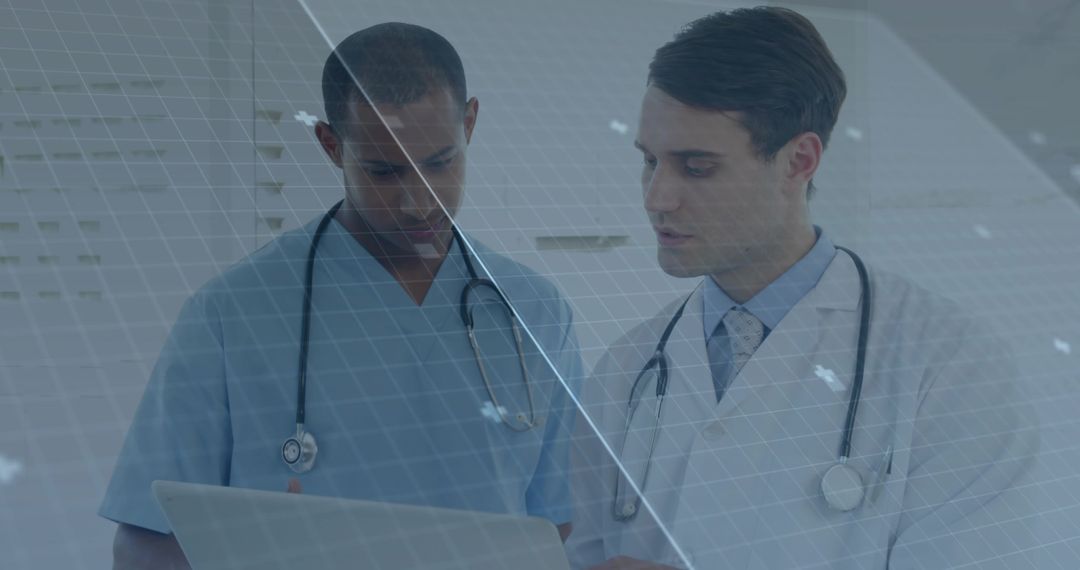 Doctors Analyzing Data on Laptop with Stethoscopes