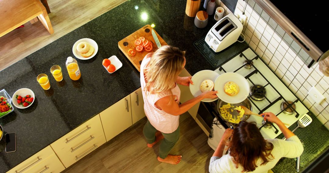 Overhead View of Women Cooking Breakfast in Modern Kitchen - Free Images, Stock Photos and Pictures on Pikwizard.com