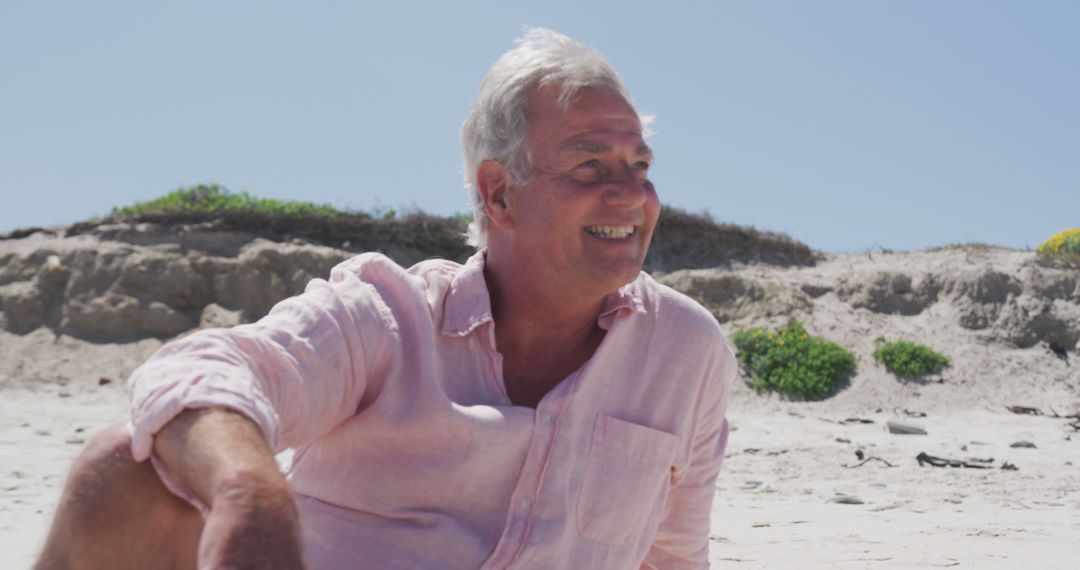 Senior Man Smiling on Beach Under Clear Sky - Free Images, Stock Photos and Pictures on Pikwizard.com