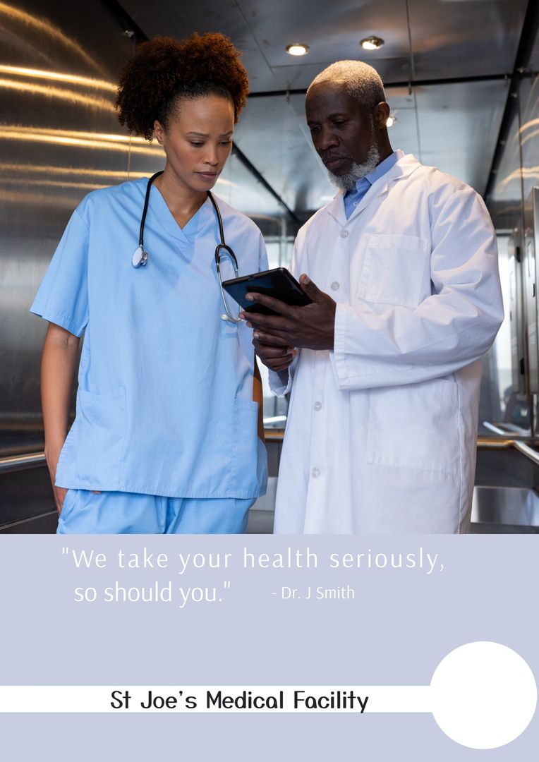 Two Healthcare Professionals Consulting in Hospital Elevator