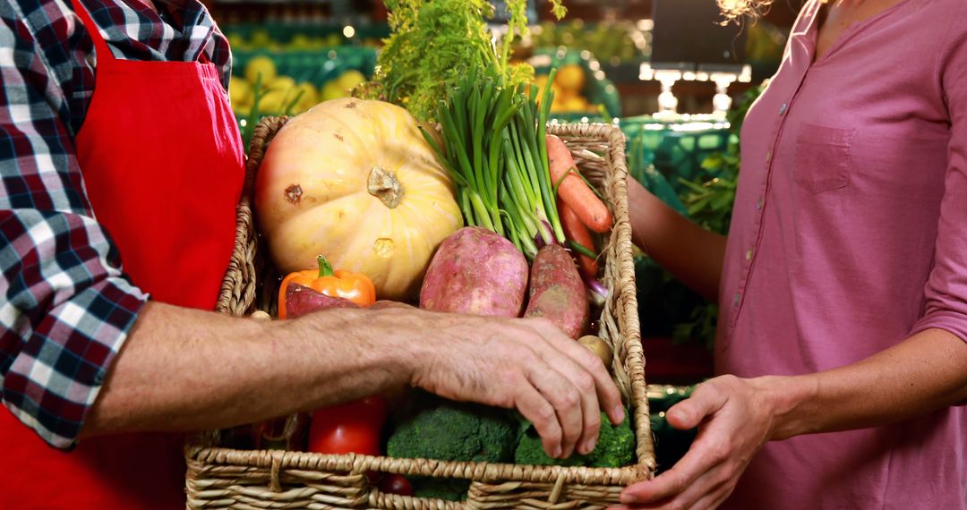 Farmer Handing Customer Basket of Fresh Veggies at Market Stall - Free Images, Stock Photos and Pictures on Pikwizard.com