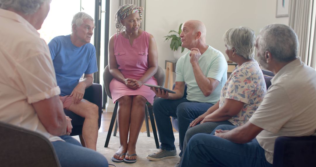 Senior Group Having a Discussion in Community Center - Free Images, Stock Photos and Pictures on Pikwizard.com