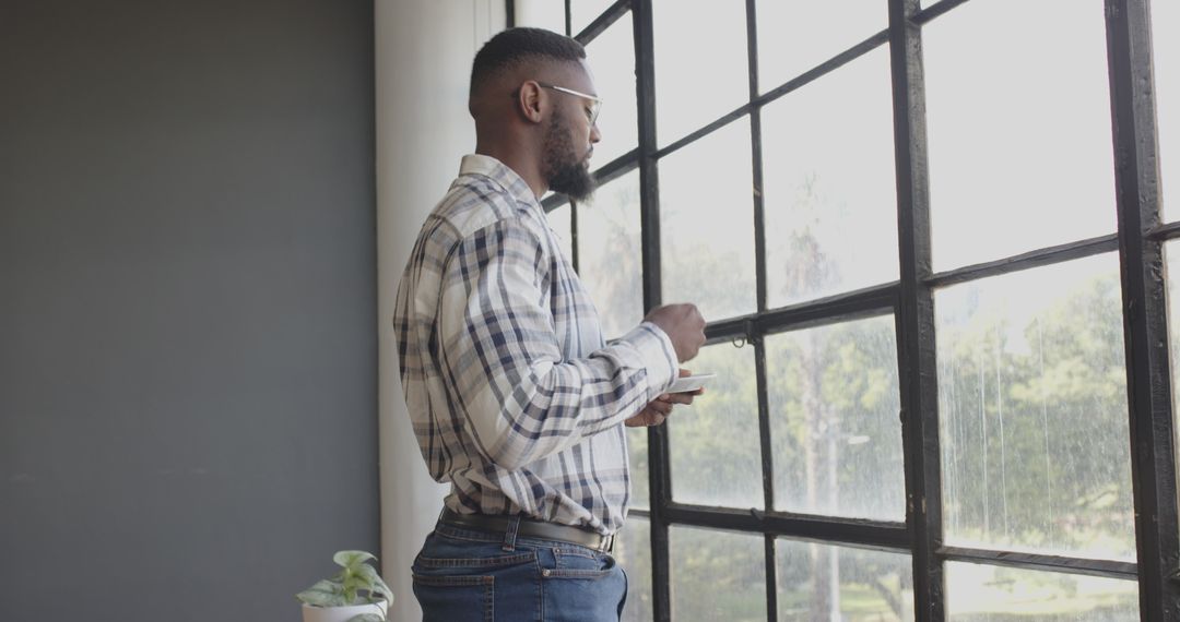 Businessman Contemplating Work While Enjoying Coffee