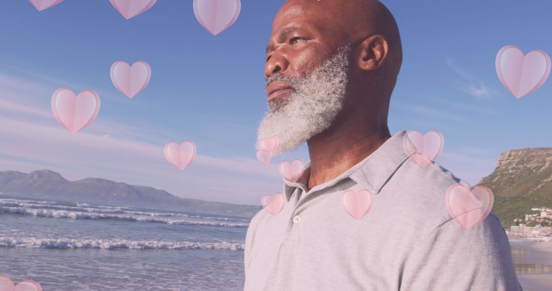 Senior Man Enjoying Beach with Heart Graphics