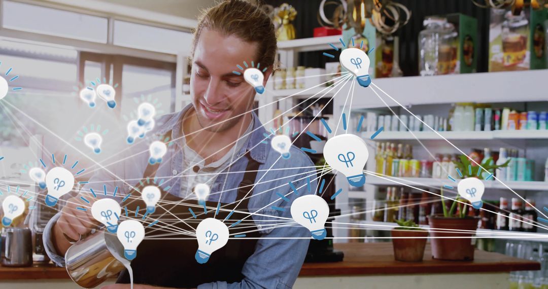 Barista pouring milk while visualizing creative network of lightbulb icons in cafe