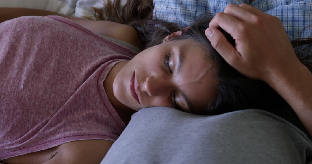 Young Woman Resting Head on Pillow in Casual Clothing with Partner - Free Images, Stock Photos and Pictures on Pikwizard.com