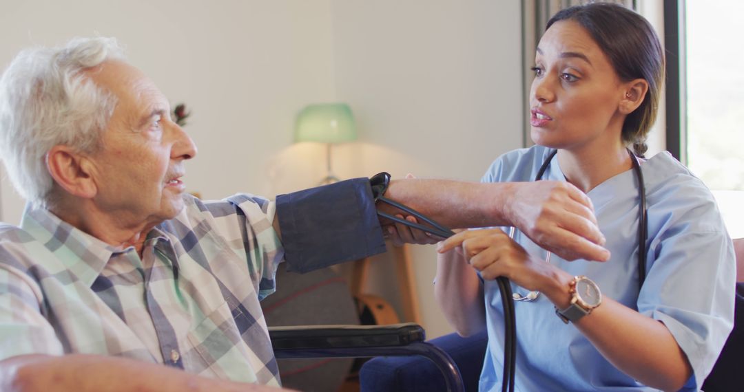 Nurse Checking Elderly Man's Blood Pressure at Home - Free Images, Stock Photos and Pictures on Pikwizard.com