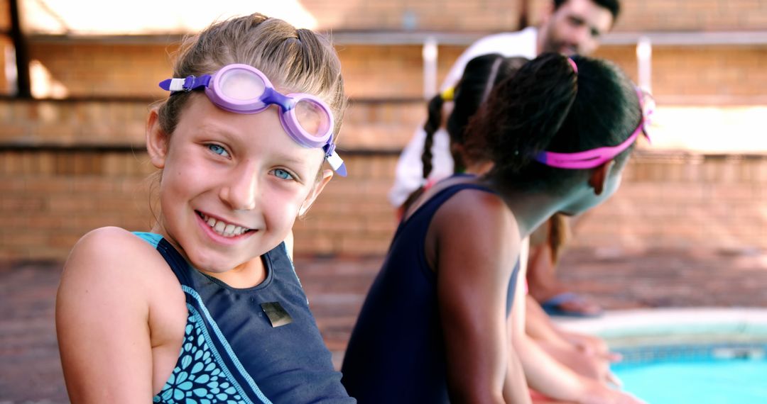 Smiling Girl Wearing Swim Goggles by Poolside - Free Images, Stock Photos and Pictures on Pikwizard.com