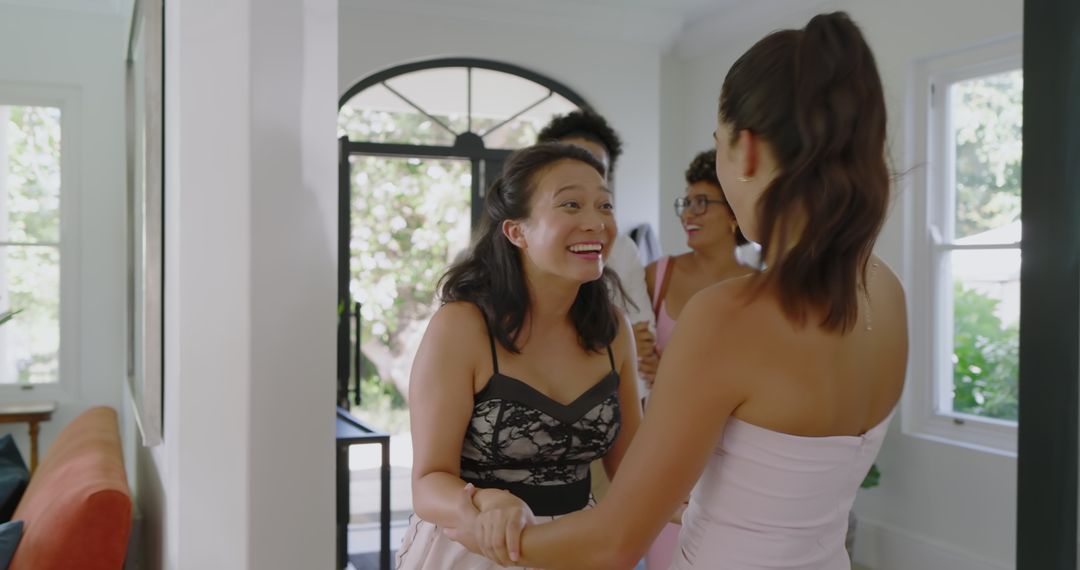 Friends Joyfully Greeting and Catching Up at Home