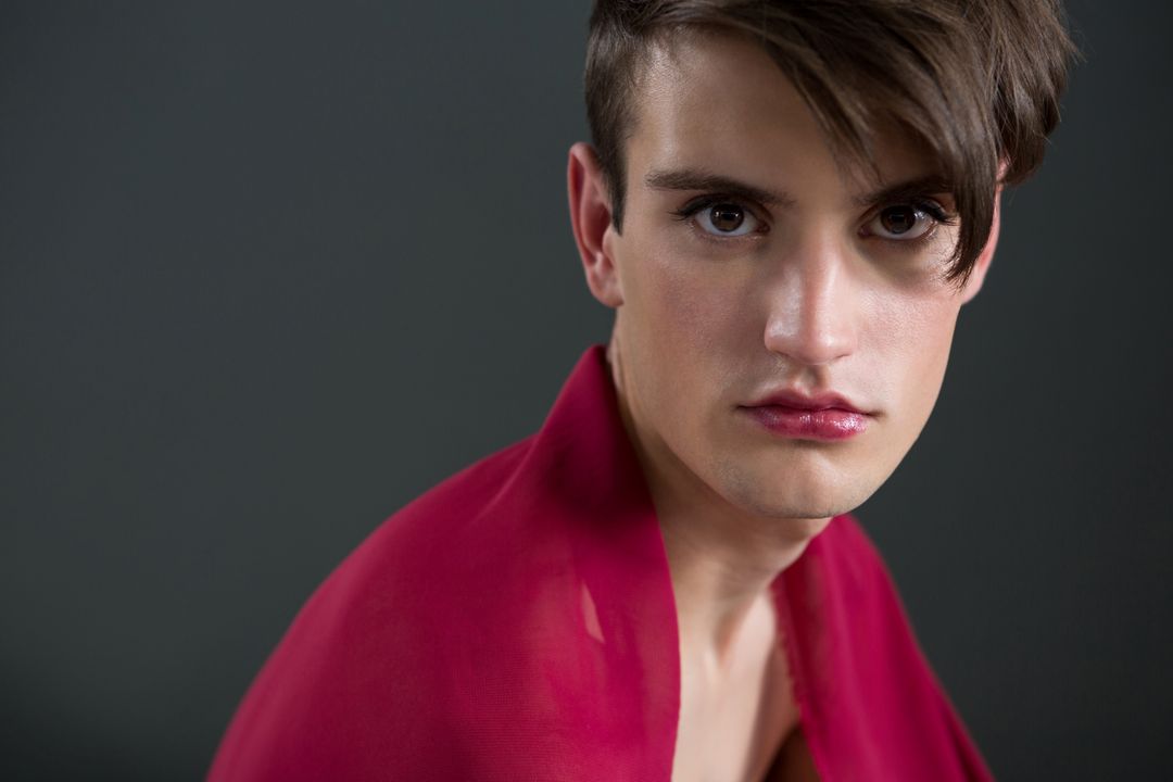 Androgynous man wrapped in red clothes - Free Images, Stock Photos and Pictures on Pikwizard.com